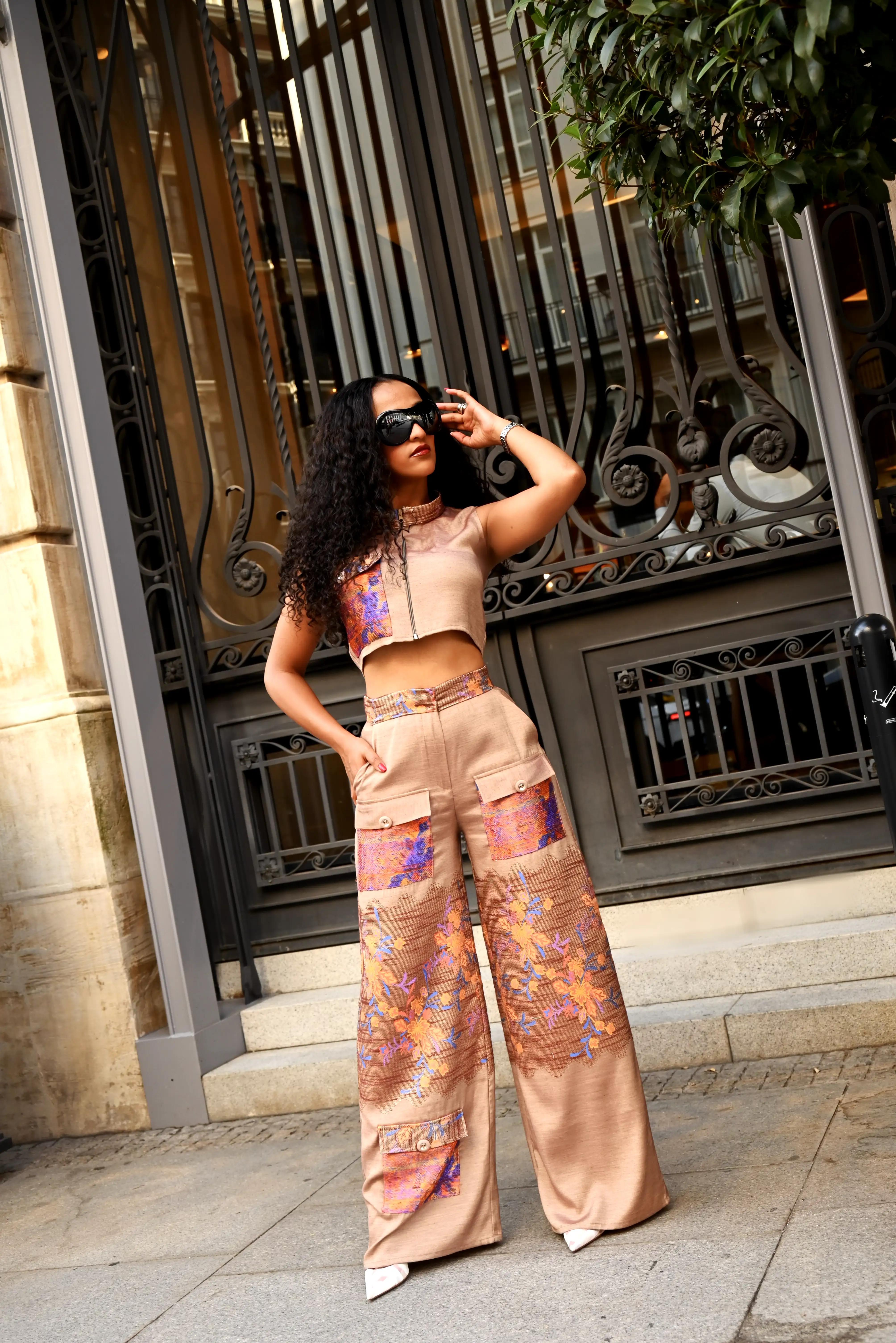 Model wearing the Urban Bloom set against an ornate ironwork facade